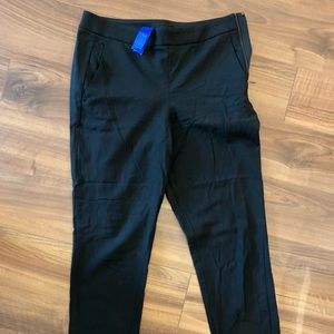 Black full-length dress pants.